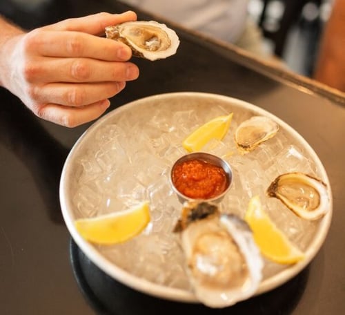 farmers_oysters_heron-1 farmers_oysters_heron-1